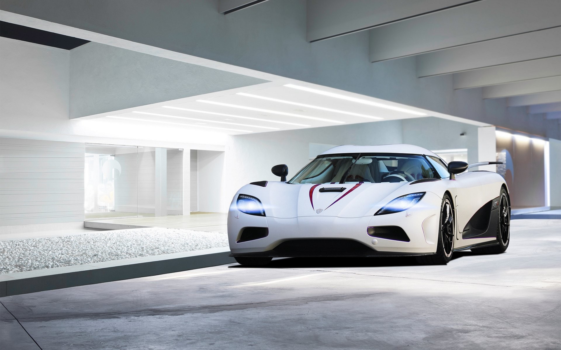 White Koenigsegg Agera R parked in a modern garage