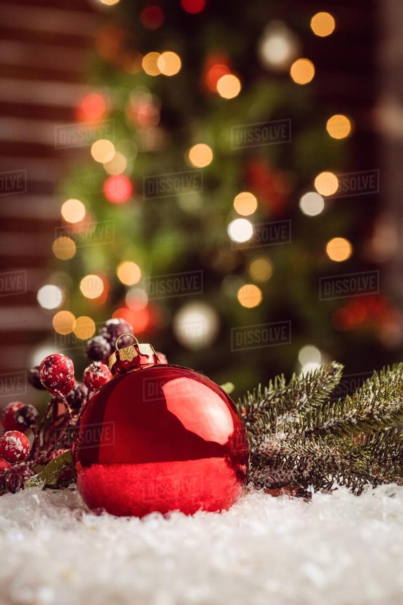 Posite Image Of Christmas Bauble And Holly Against