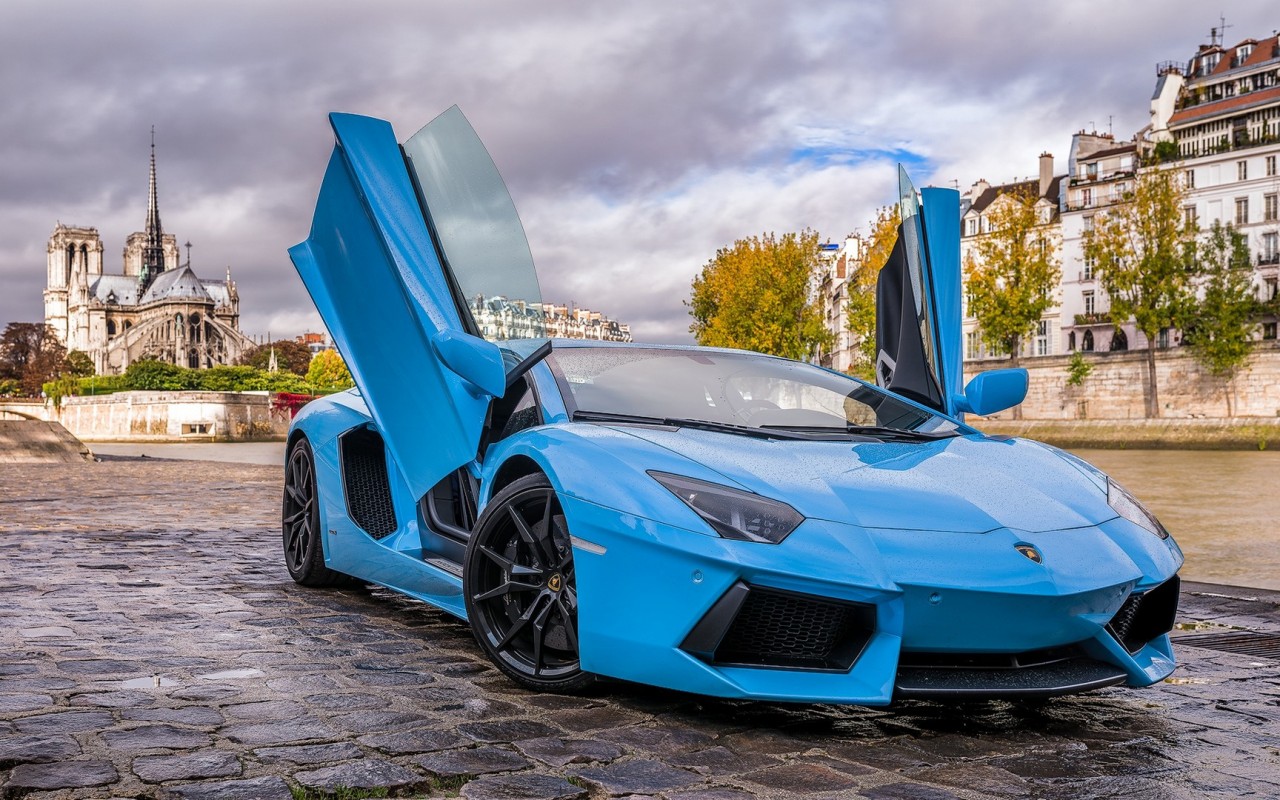 Blue Lamborghini Aventador With Doors Open On City Street Photo