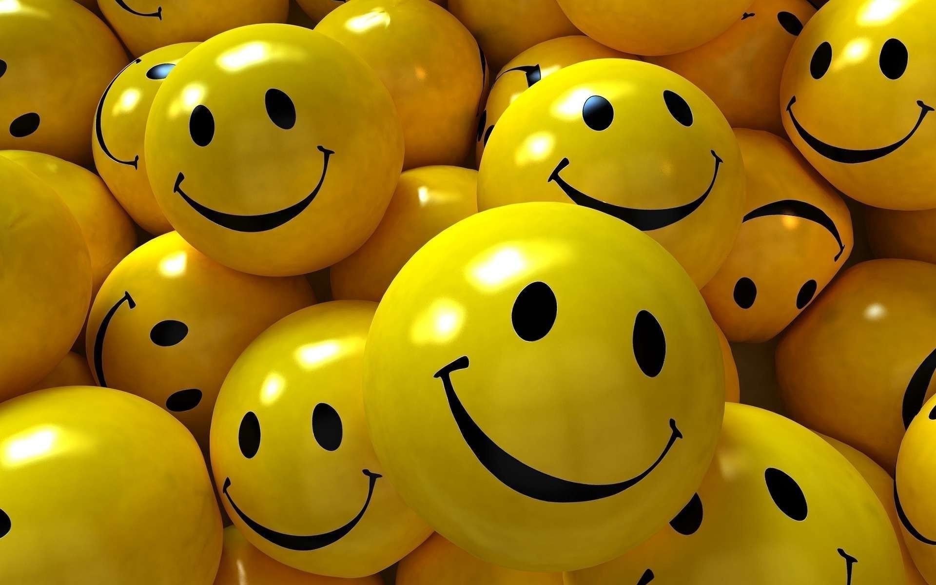 A cheerful close-up of numerous 3D yellow smiley faces, evoking happiness and positivity
