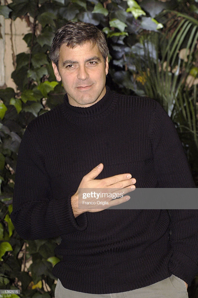 Actor Director George Clooney Poses For Photographers During A