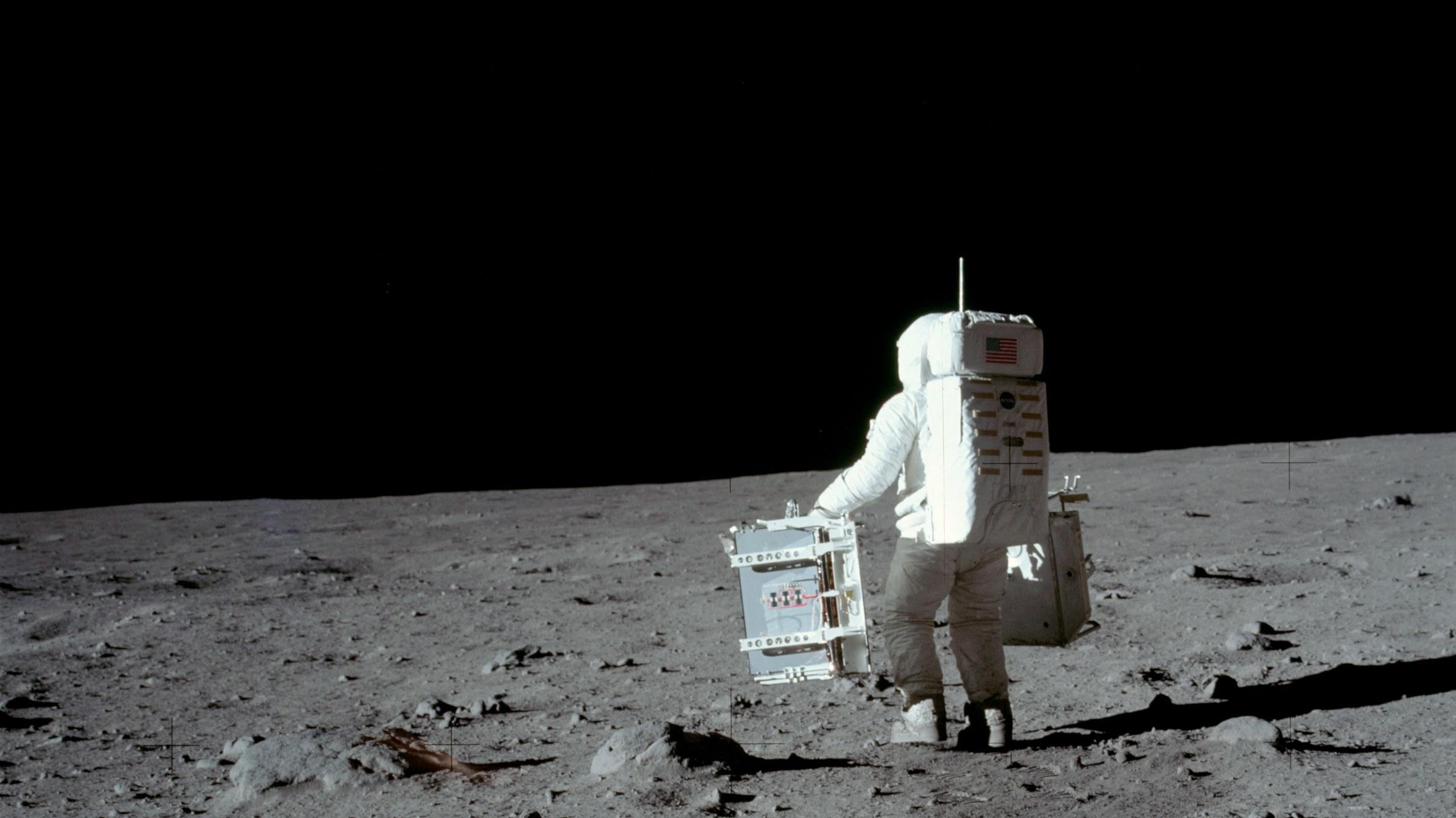 Apollo Aldrin Carries Experiments