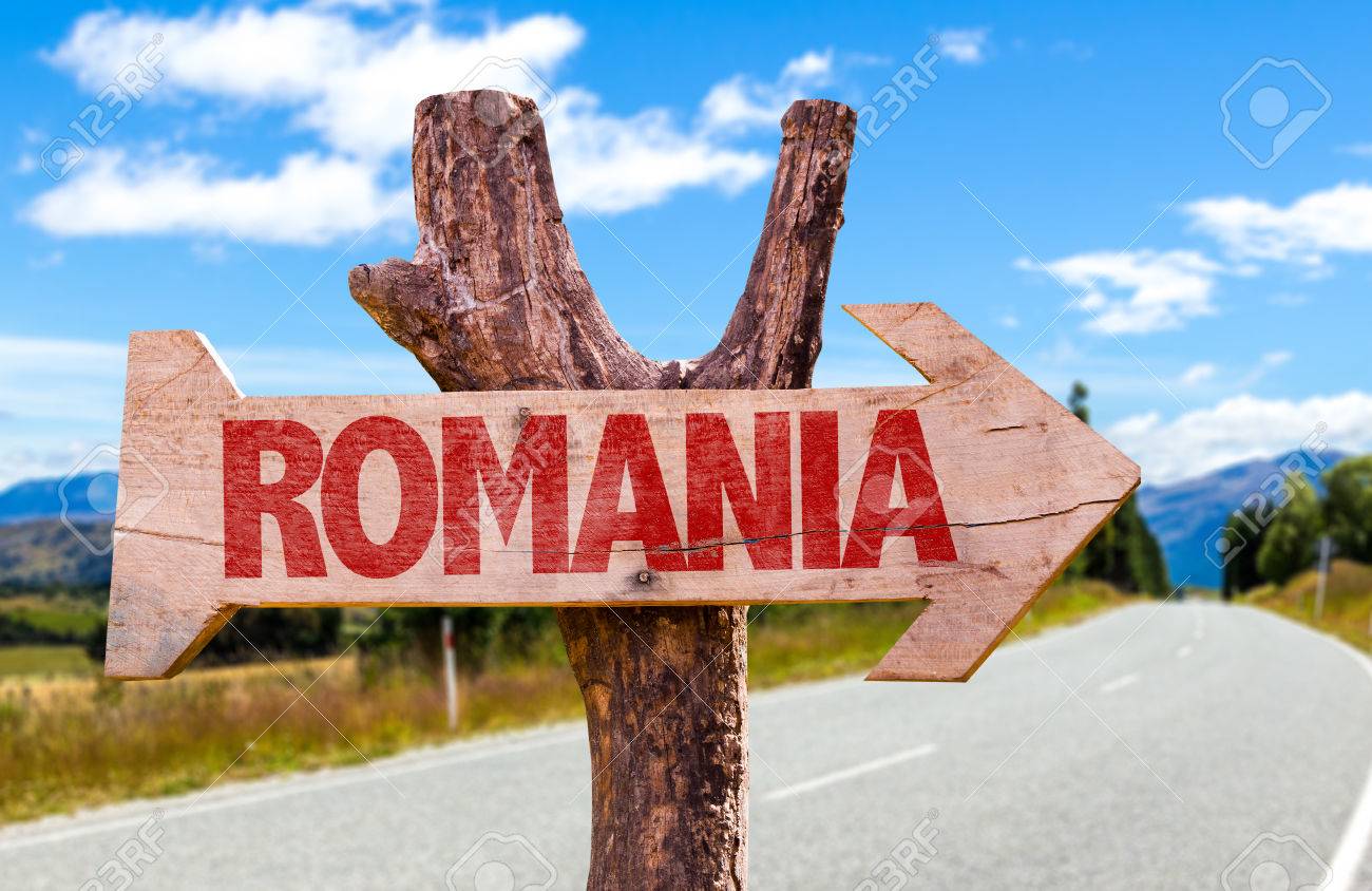 Romania Sign With Arrow On Road Background Stock Photo Picture