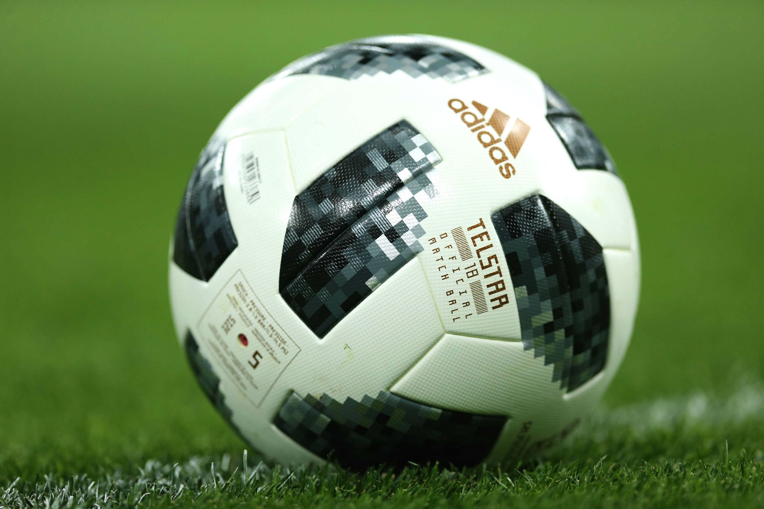 Adidas Telstar Ball On Ground Wallpaper Fifa World Cup