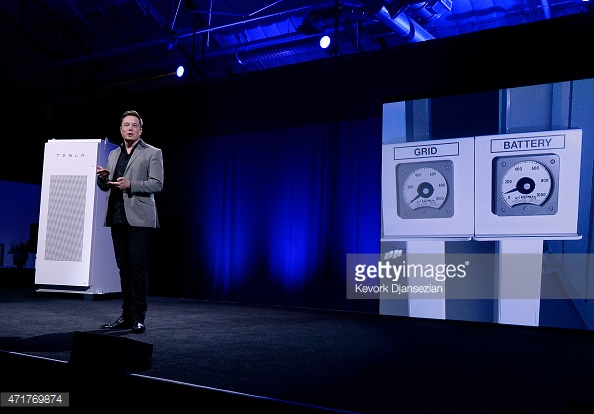 Elon Musk Ceo Of Tesla With A Powerpack System In The Background