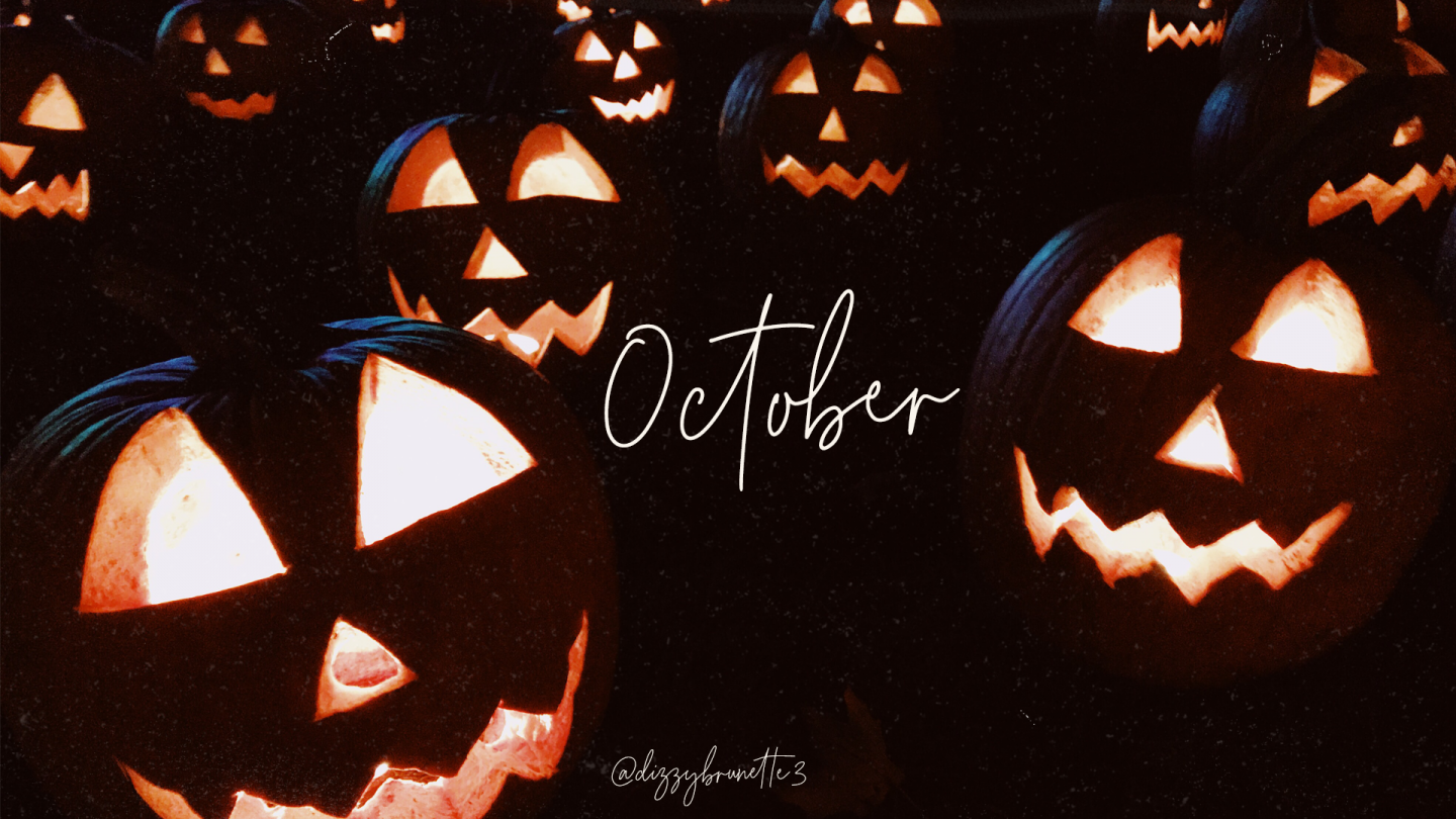 Spooky jack-o'-lanterns glowing in the dark, perfect for an October fall wallpaper