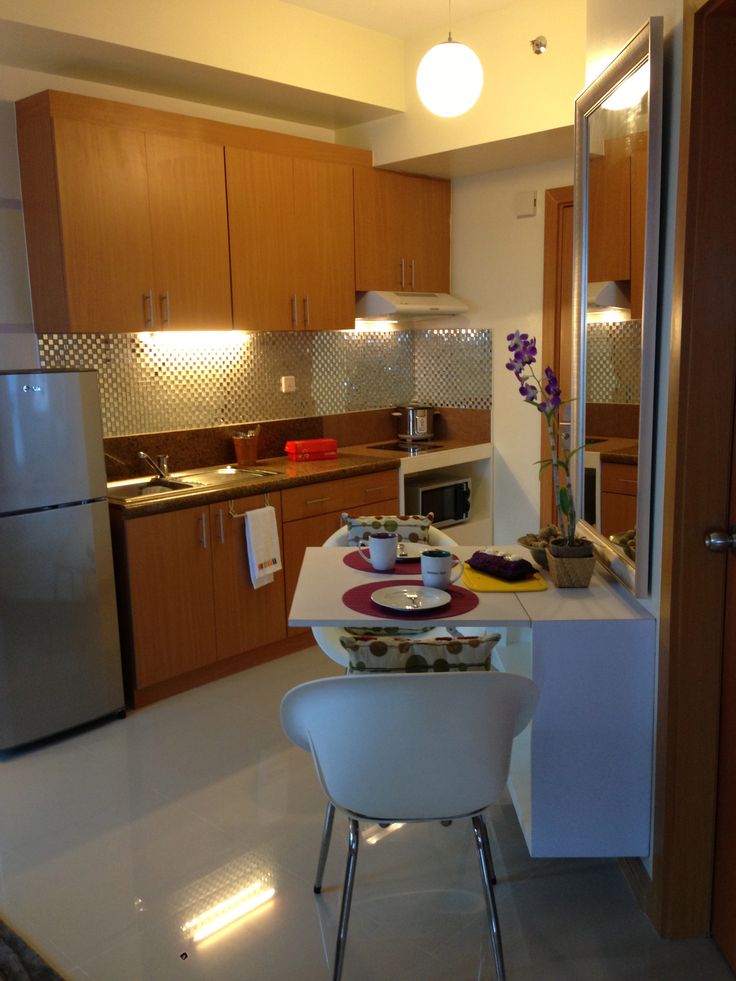 The dining area of the one bedroom condo unit at Trion Towers The 736x981