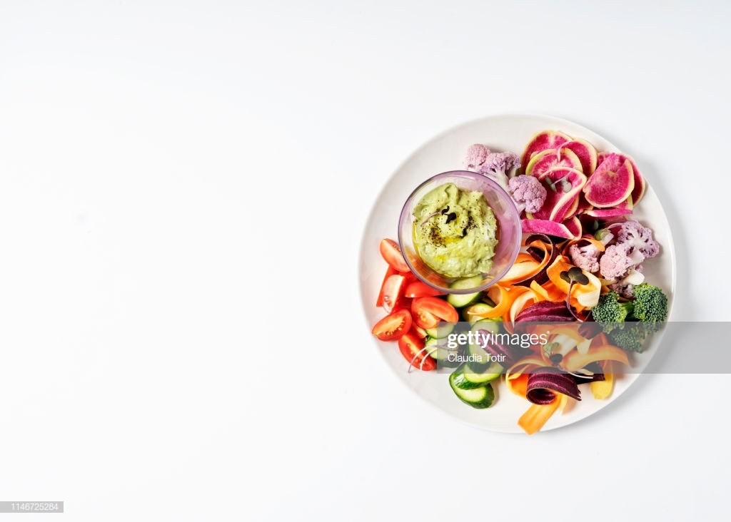 A Platter Of Chopped Vegetables On White Background Stock Photo