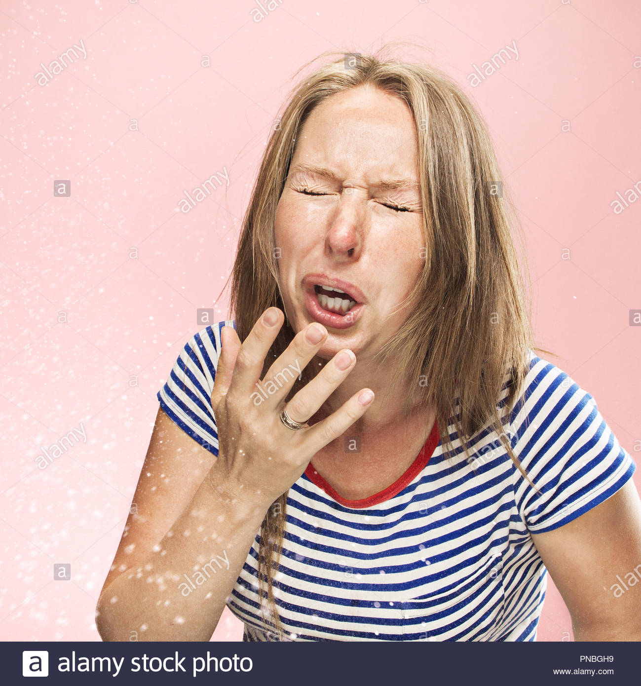 Young Funny Woman Sneezing With Spray And Small Drops Studio