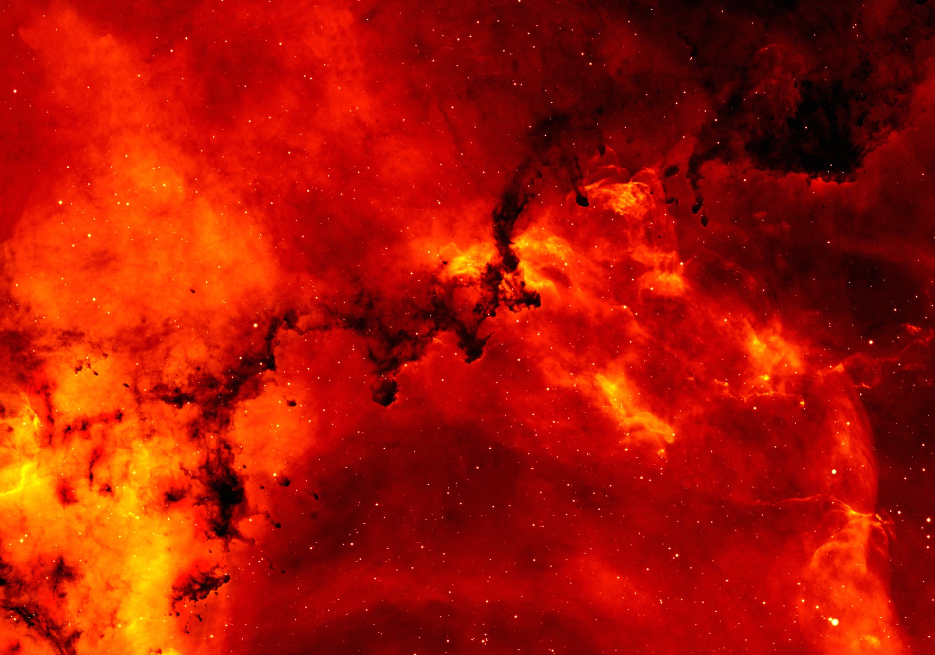 Vivid red and orange nebula with dark swirling clouds, resembling a cosmic inferno or solar flare