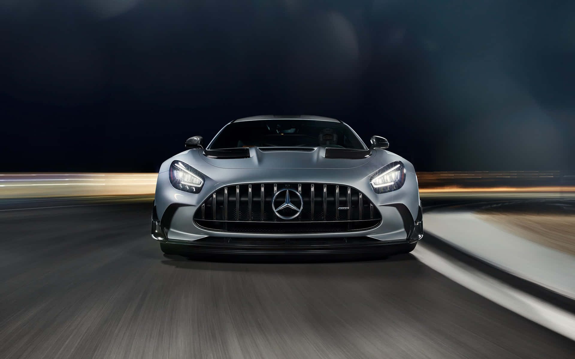 Stunning Mercedes Gts Gliding Down A Scenic Road Wallpaper