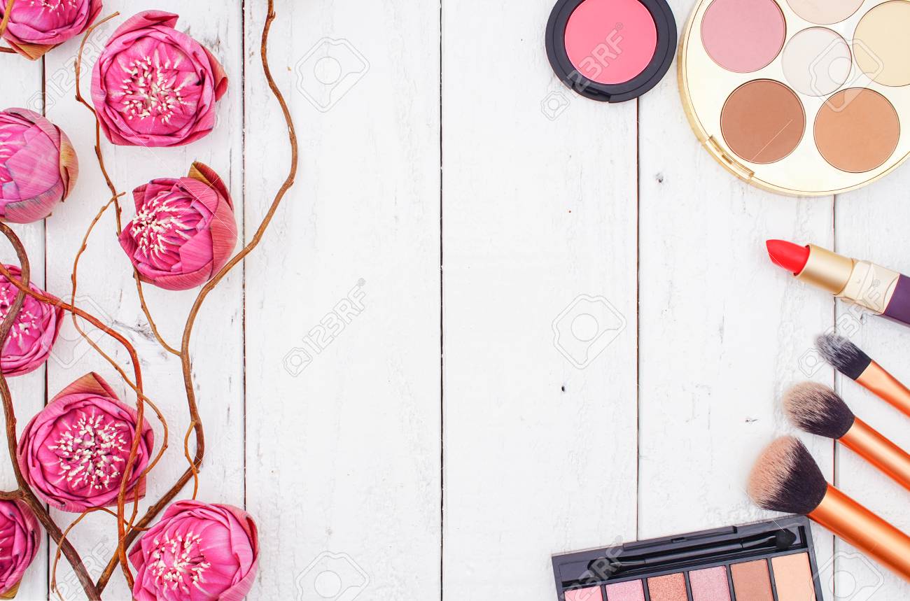 Makeup Cosmetics And Pink Lotus On White Wooden Background Flat