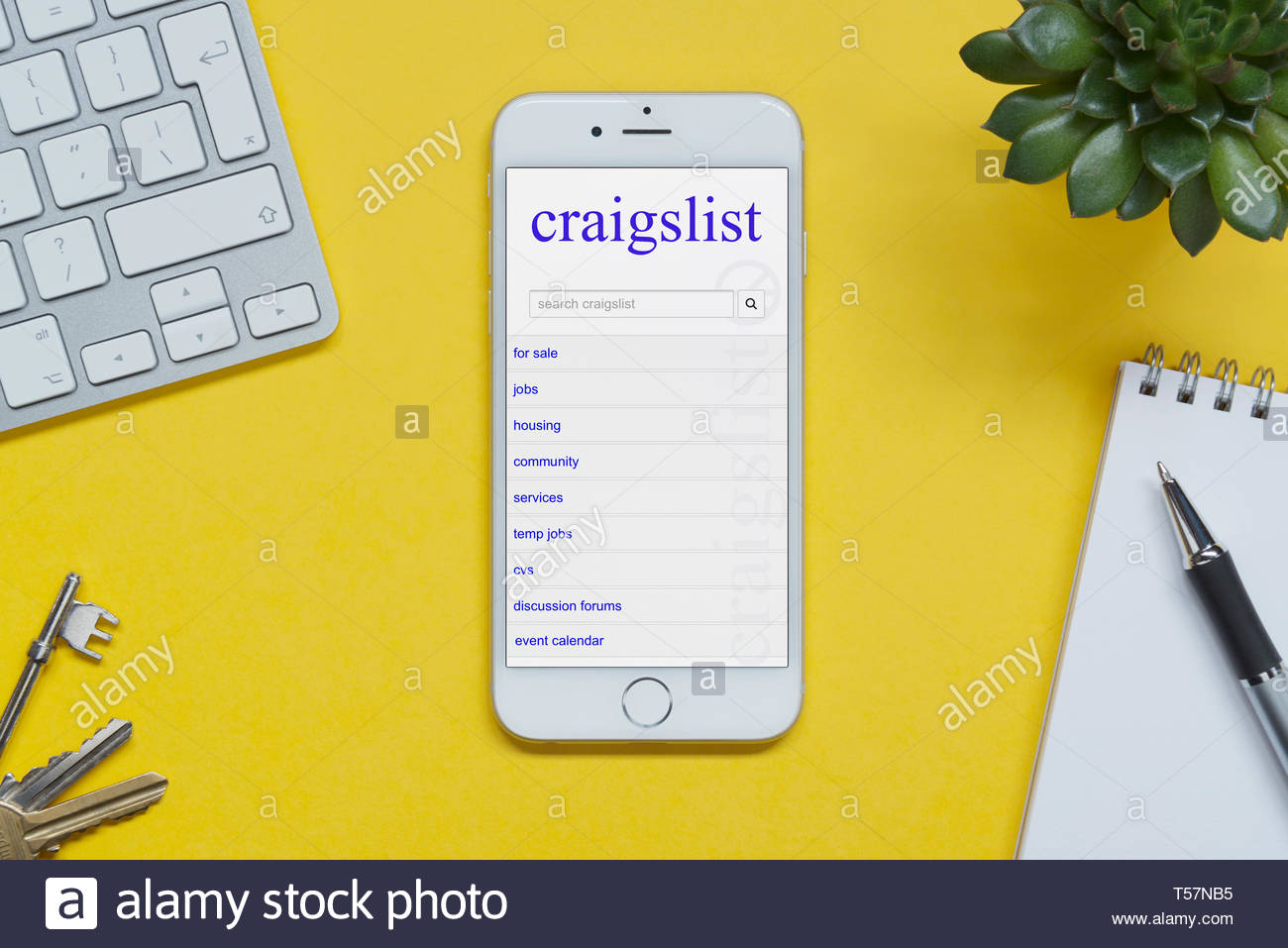 Free download An iPhone showing the Craigslist website rests on a