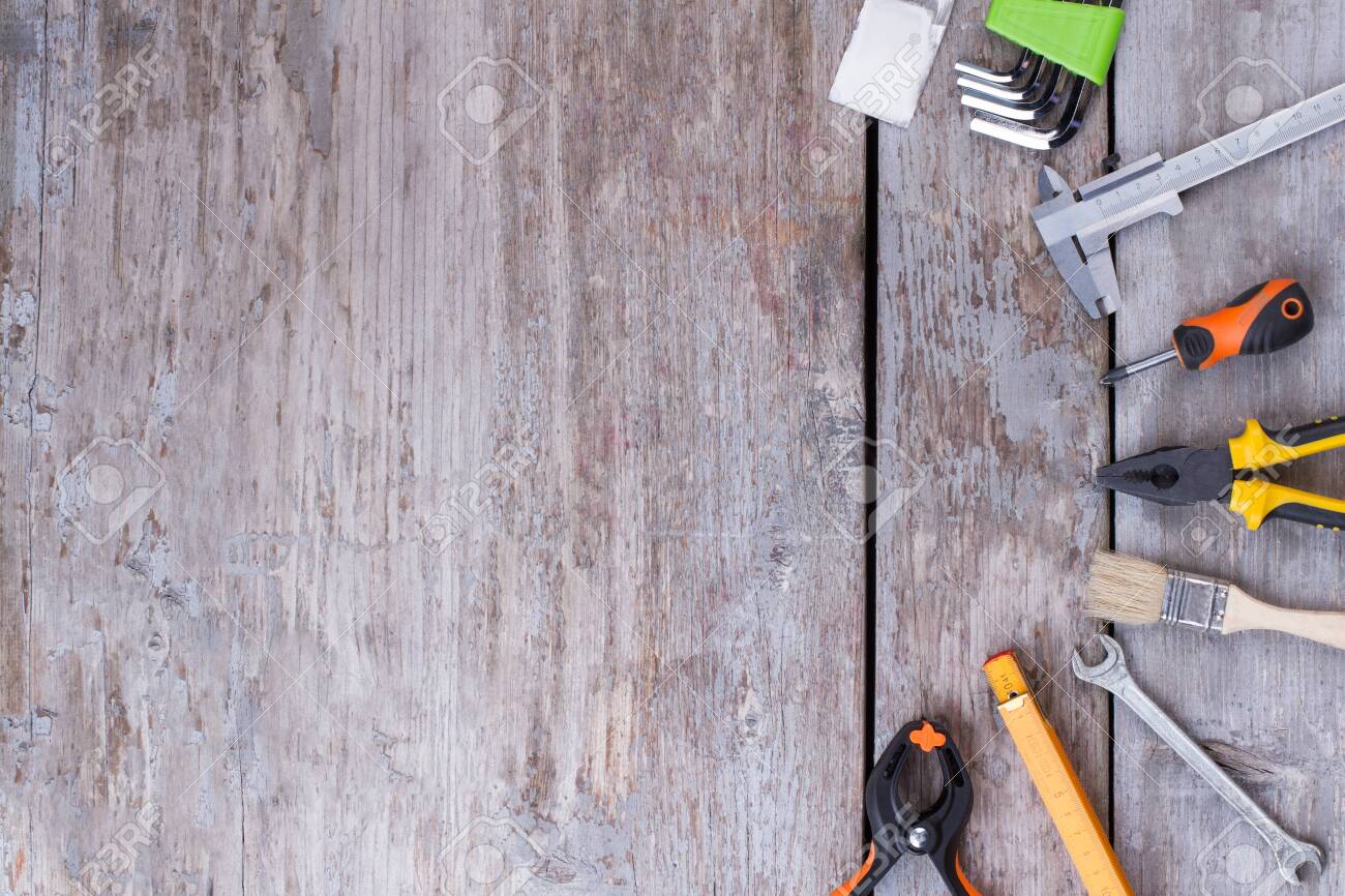 Free download Tools Kit On A Wood Background Set Of Construction Tools
