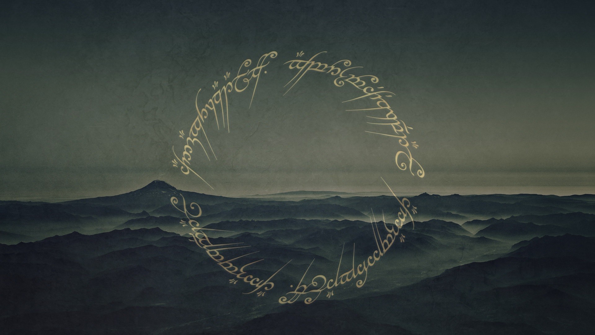A breathtaking vista of the misty mountains of Middle-earth, featuring the One Ring inscription in Tengwar script. This evocative image captures the epic scale and mystique of the Lord of the Rings