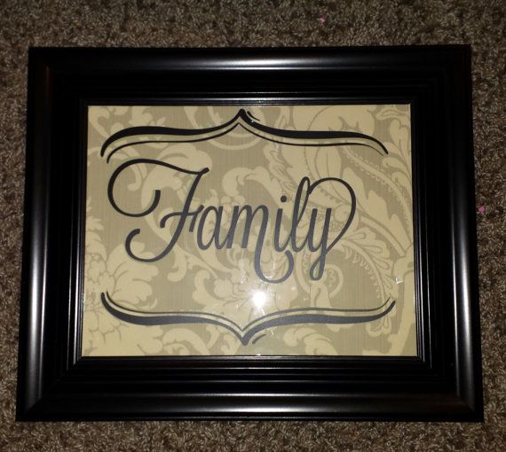 Family frame is made from vintage wallpaper and vinyl lettering on