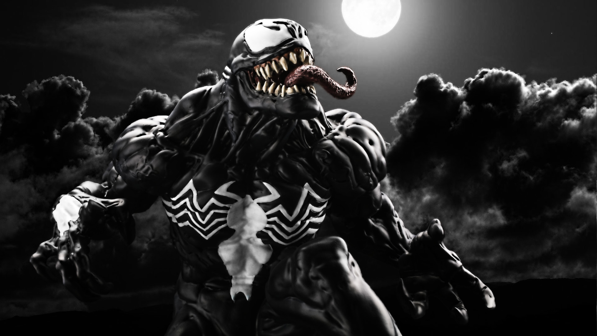 A dramatic black and white image of Venom, the Marvel Comics anti-hero, against a backdrop of a full moon and swirling dark clouds