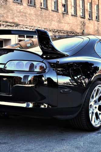 Free Black Tuned Toyota Supra wallpaper for iPhone 4