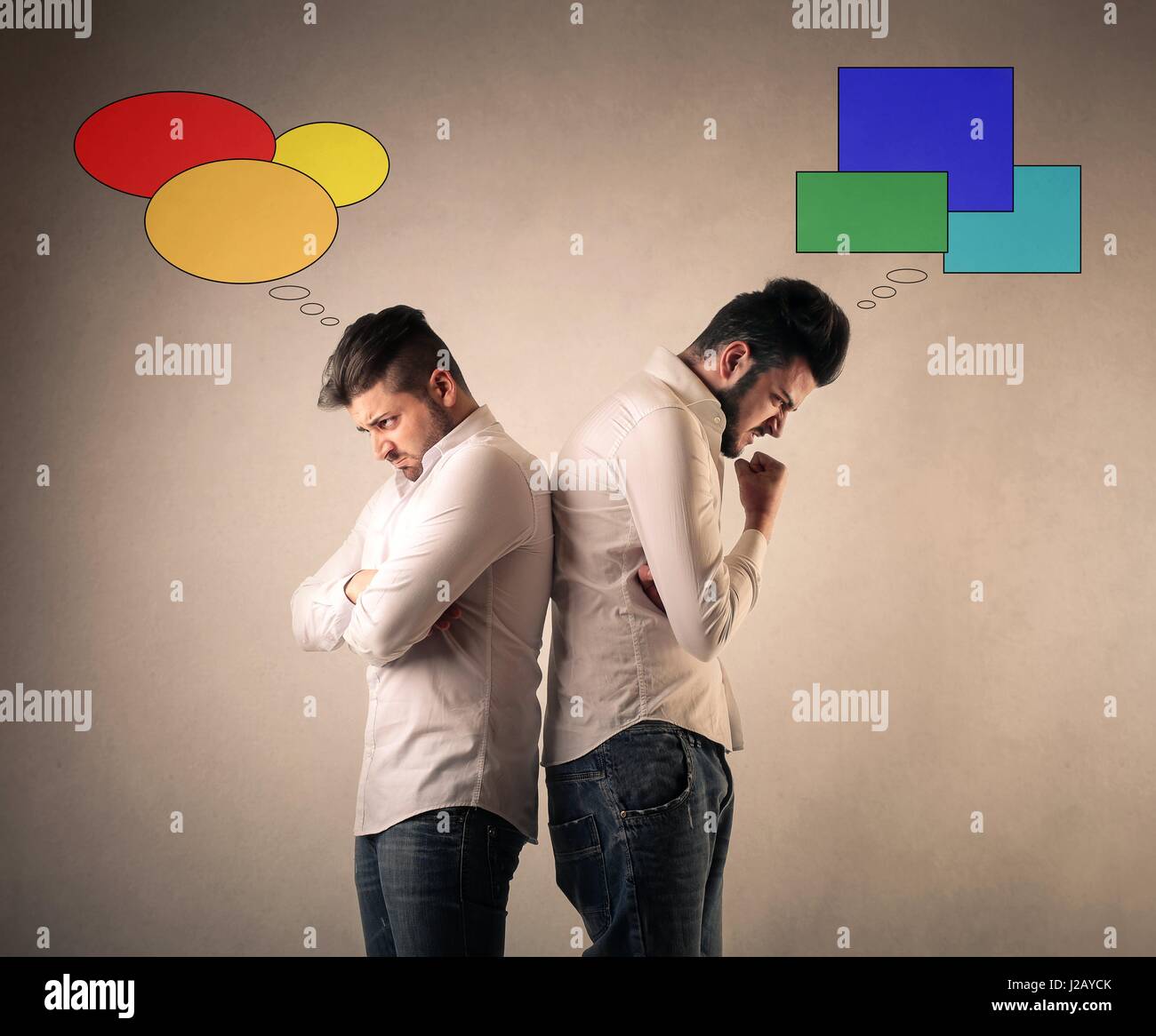 Men Thinking Differently And Being Mad At Each Other Stock Photo