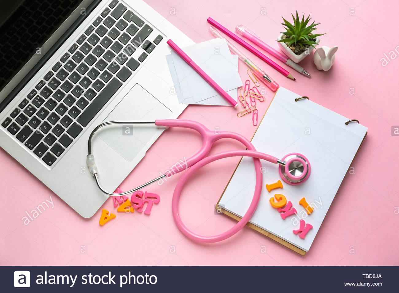 Workplace Of Pediatrician On Color Background Stock Photo