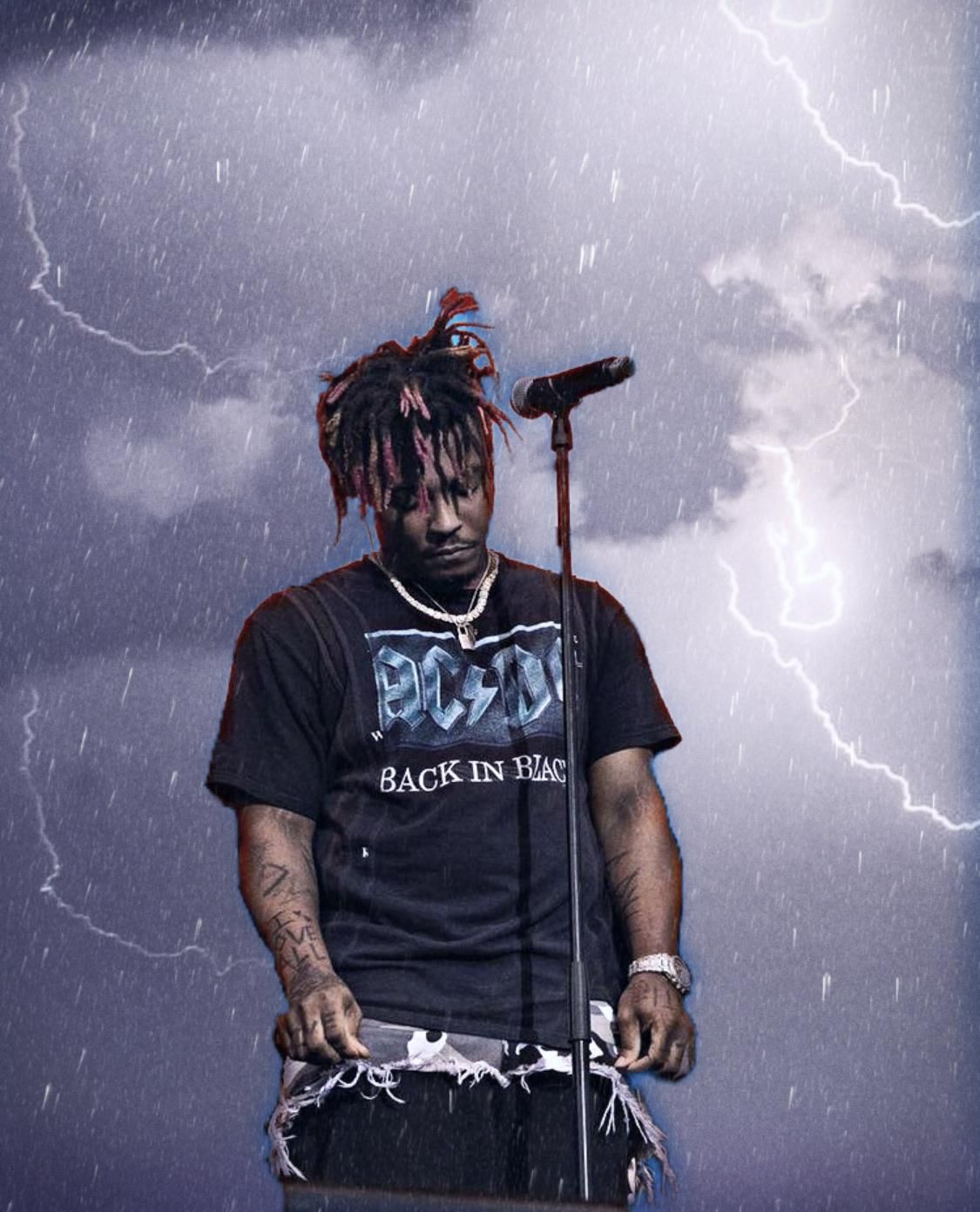 Juice WRLD performing live on stage in a dramatic, rainy, and stormy setting. 4k wallpaper