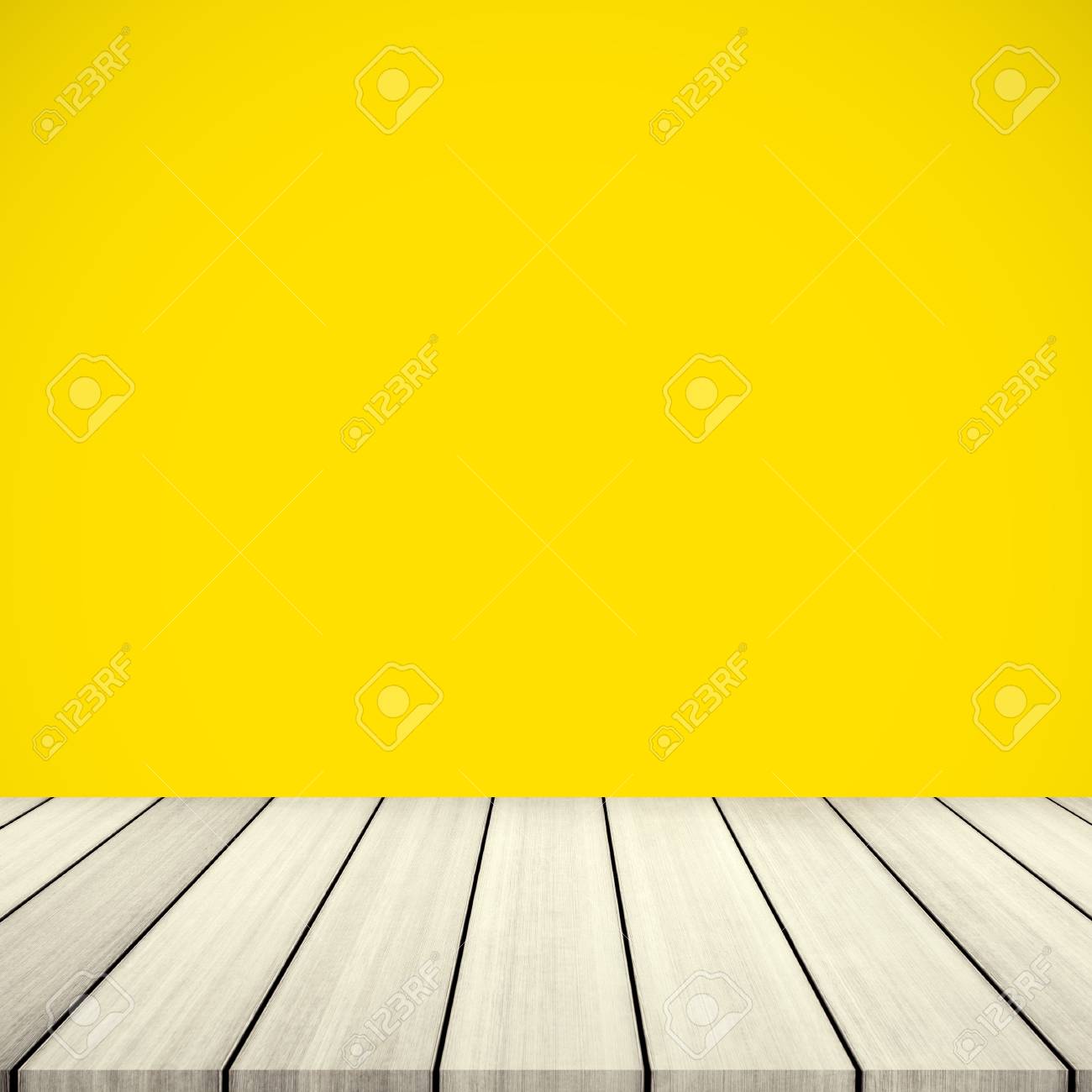 Empty Wooden Deck Table Over Yellow Wallpaper Background Stock