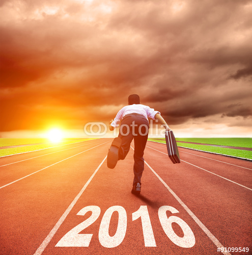 happy new year 2016 young man running with sunrise background Stock