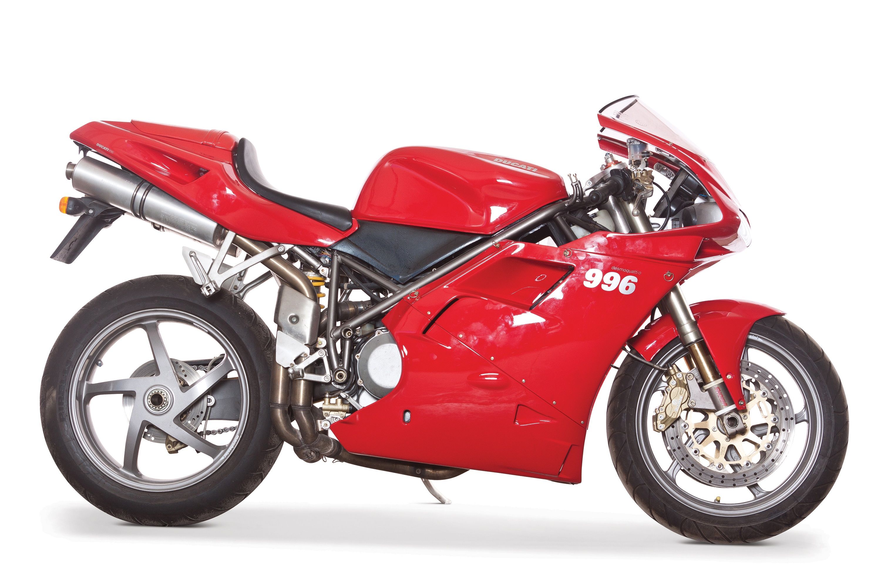 A pristine Ducati 996 sportbike in vibrant red, showcasing its iconic design and powerful presence