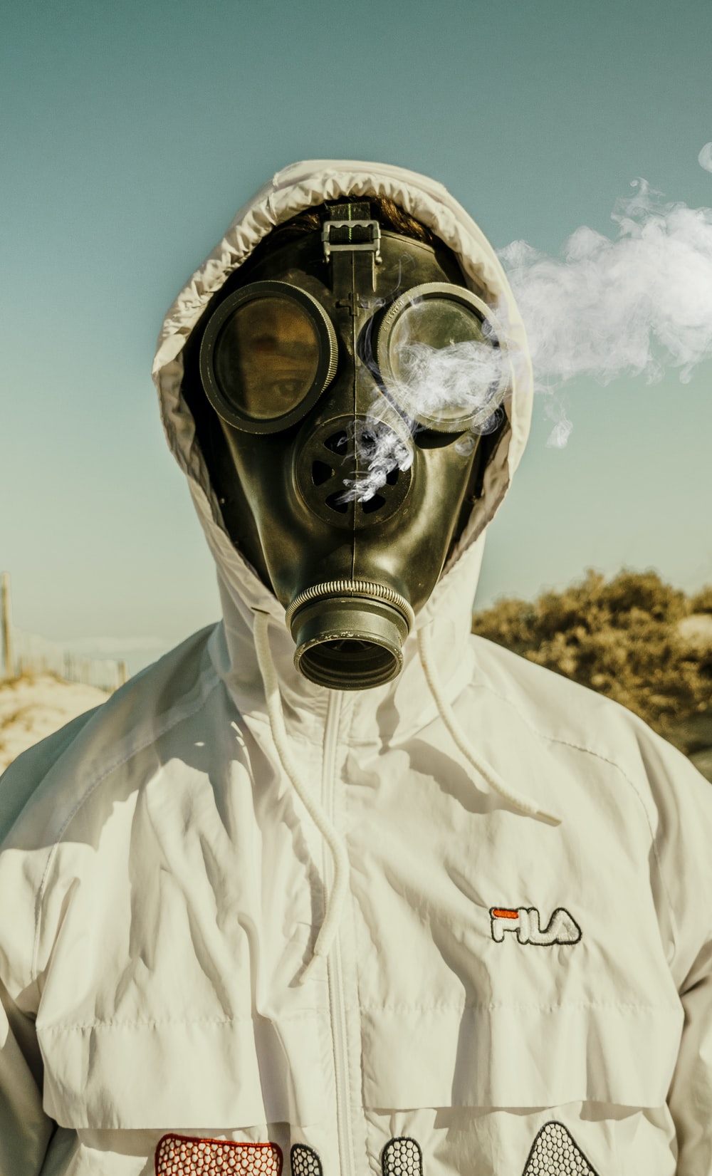 Person Wearing White And Blue Gas Mask Photo Houmt Souk