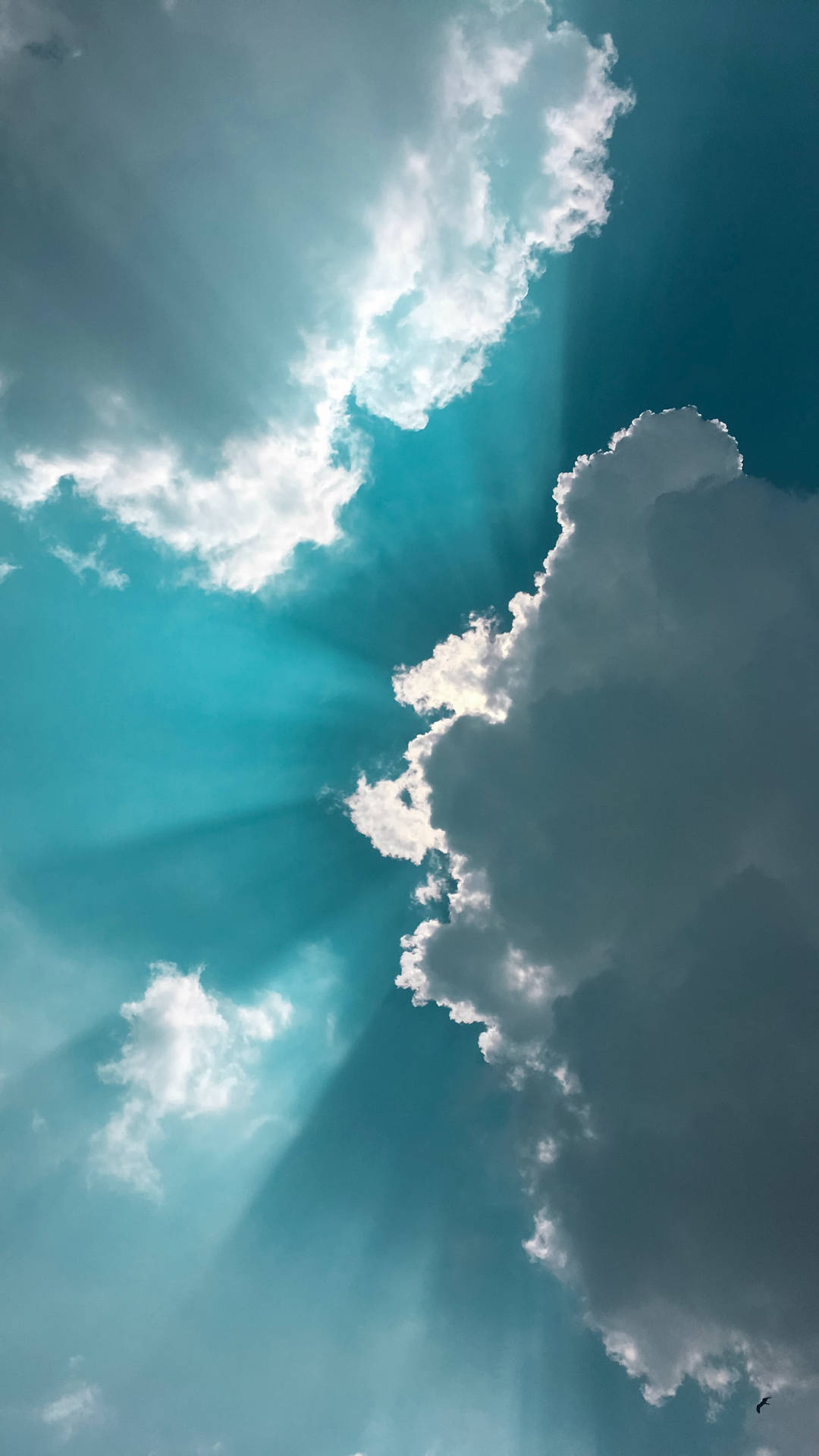 Soft Turquoise Clouds In A Bright Blue Sky Wallpaper