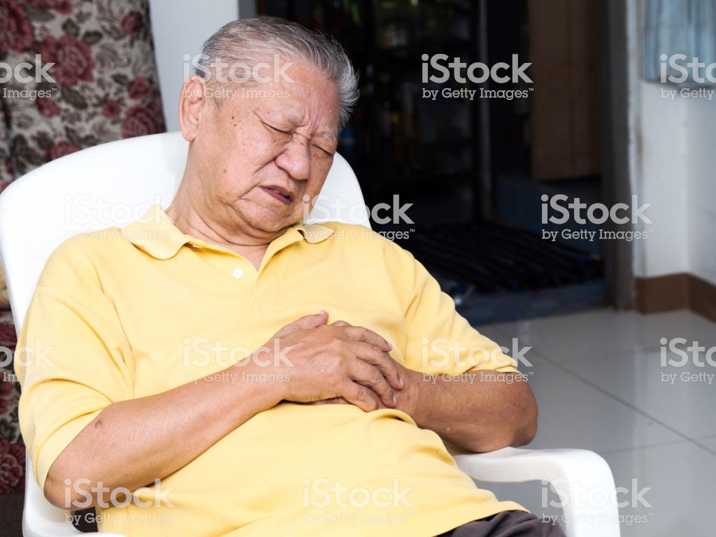 Senile Asian Men Sitting On A Chair At Living Room With Heart