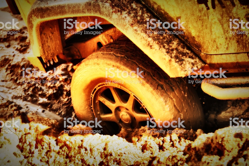 HD Background Offroad Wheels Stuck In Mud Stock Photo