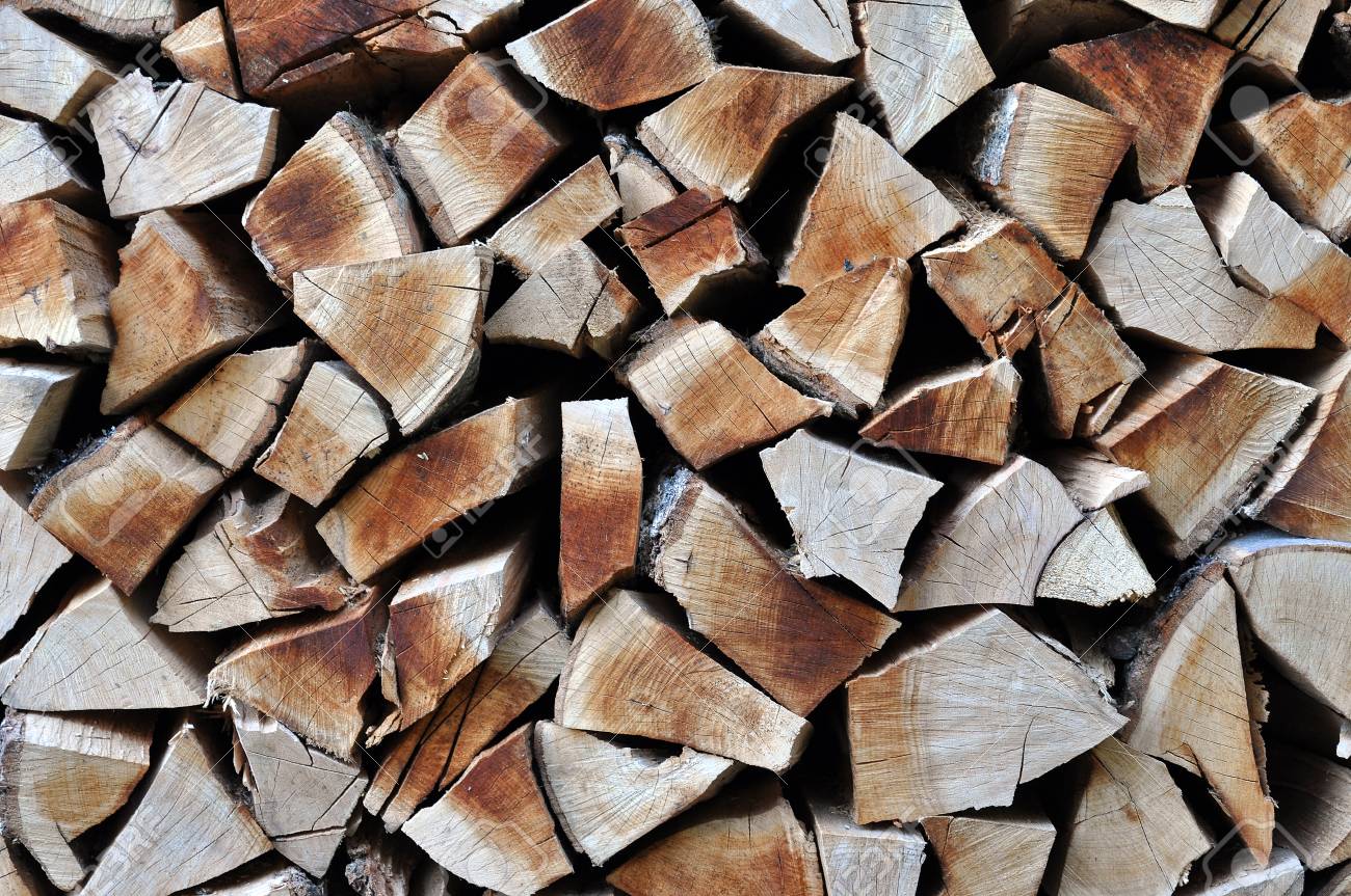 Natural Wooden Background Chopped Firewood Stacked