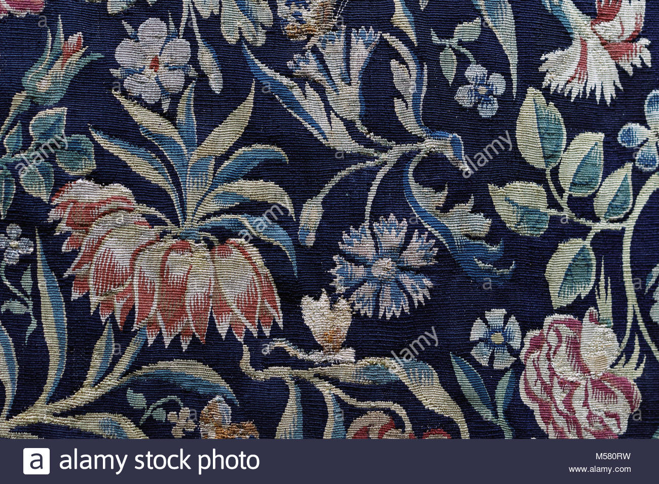 Old Floral Tapestry Background In Dark Blue Stock Photo