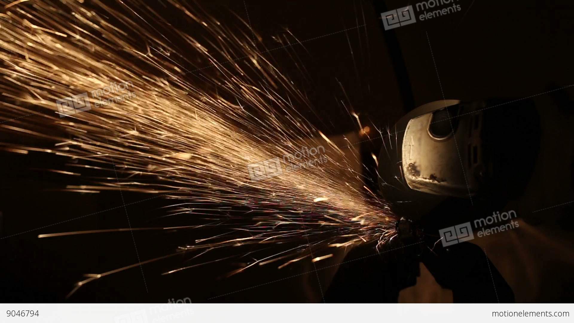 Sparks Fly While The Man Cutting A Metal Rod With