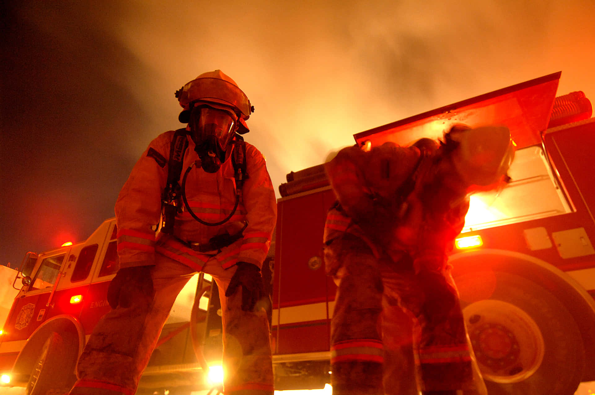 Los Angeles Fire Department firefighters battling a blaze at night