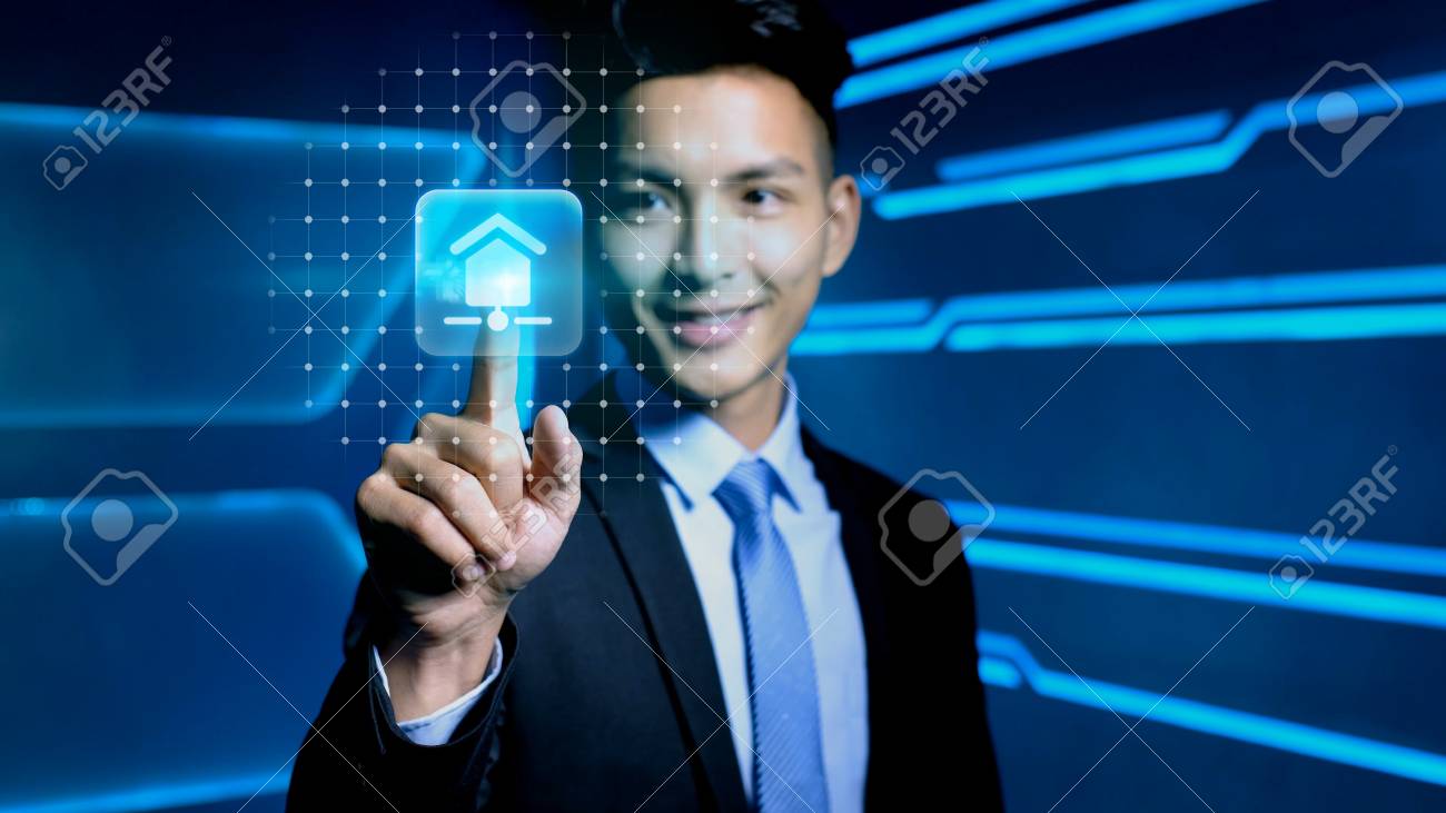 Businessman Touch Smart Home Icon On Blue Background Stock Photo
