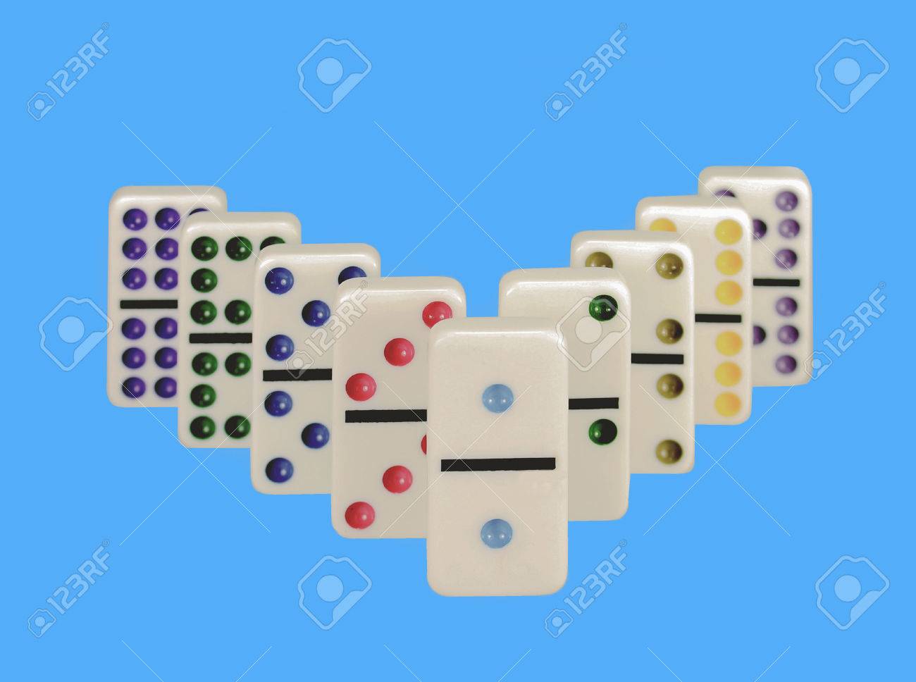Close up Of Dominos With Colorful Dots Isolated Against Blue