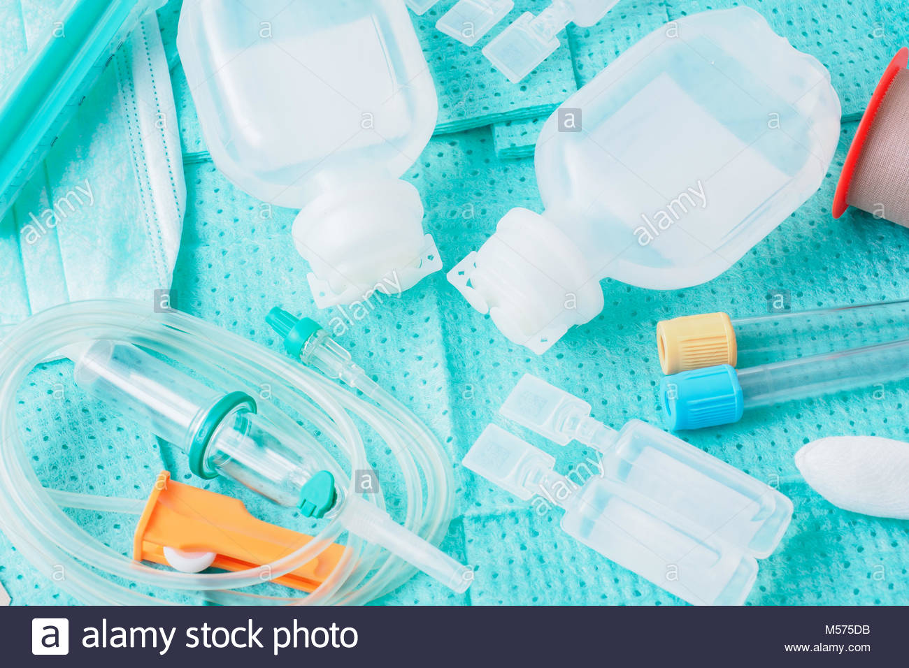 Disposable Infusion Set On Green Background Stock Photo