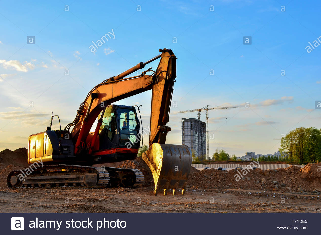 Heavy Tracked Excavator At A Construction Site On Background Of