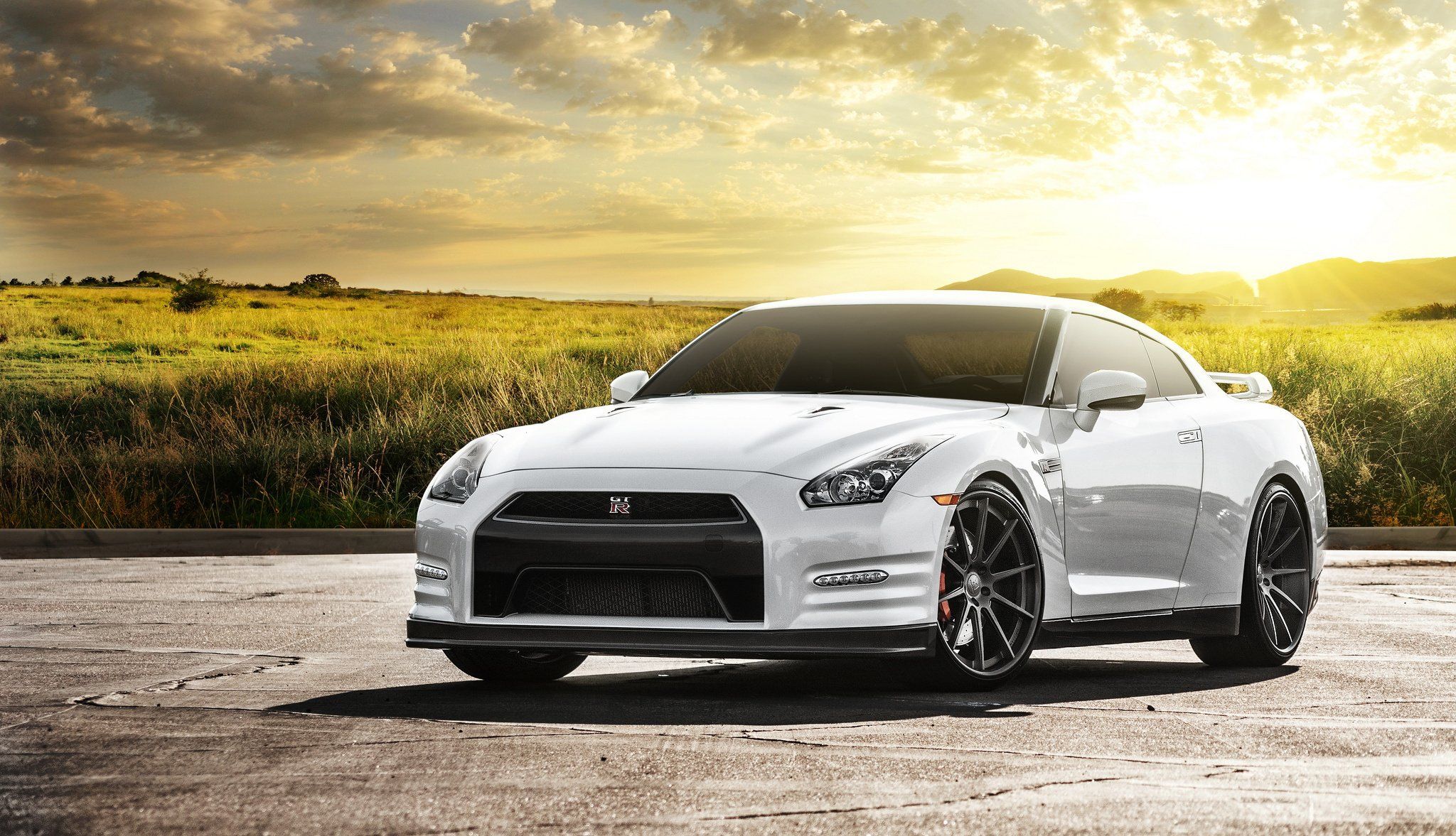 Nissan Gt R On The Background Of Field With Rising Sun