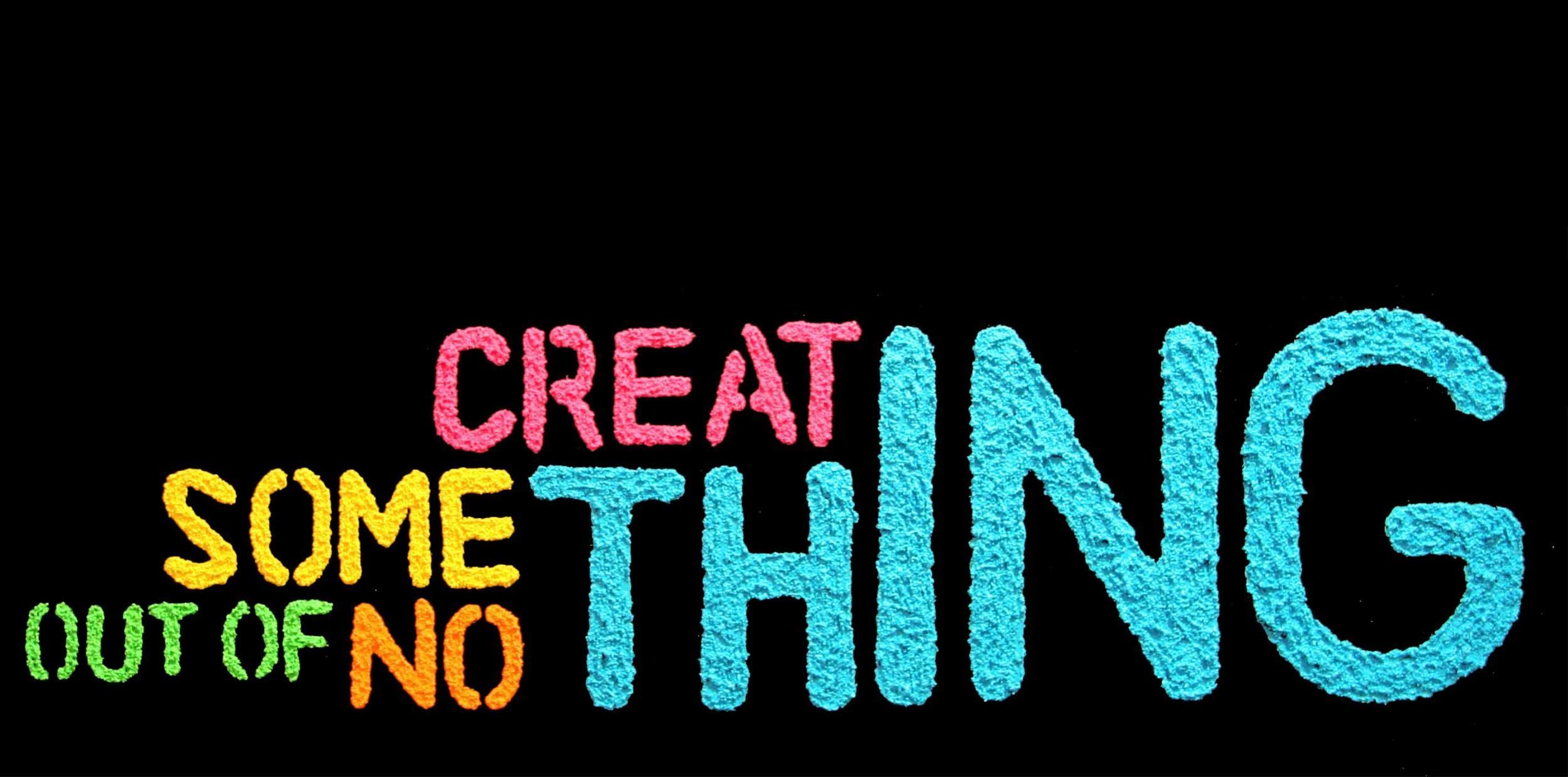 Colorful motivational phrase 'Create something out of nothing' on a black background