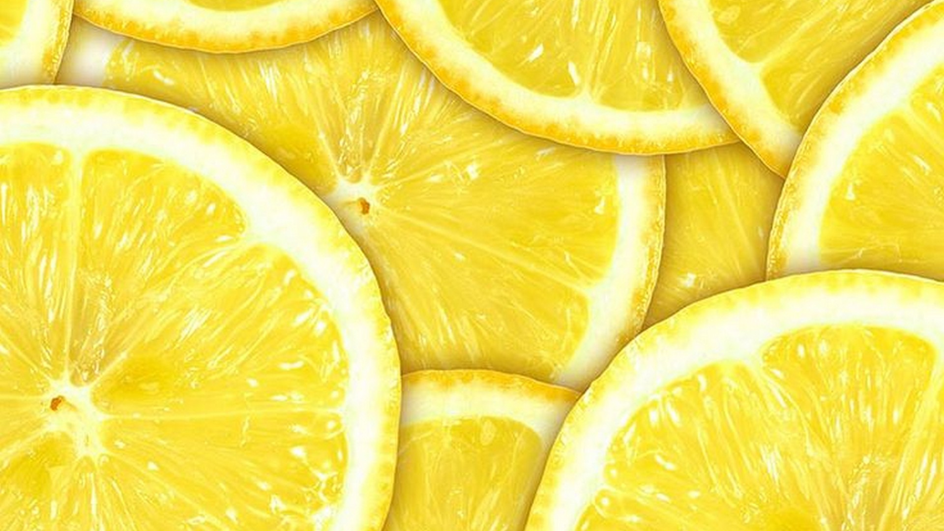 Close-up of vibrant yellow lemon slices, showcasing their juicy texture and creating a refreshing citrusy background