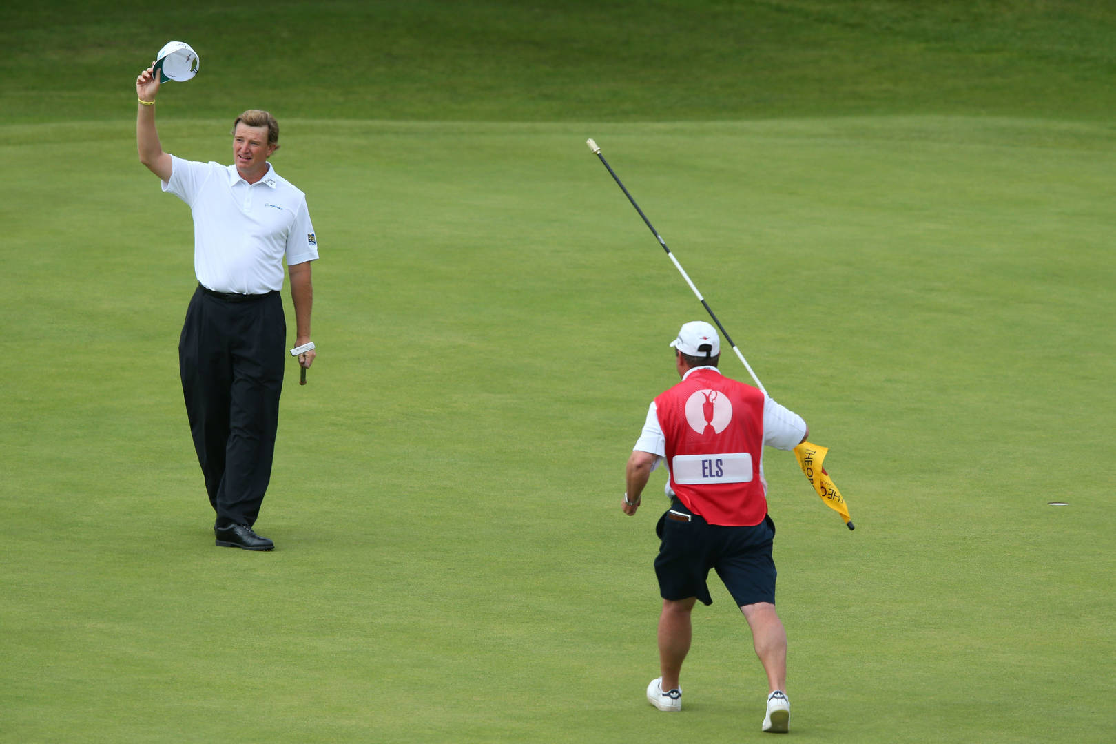 South African Pro Golfer Ernie Els With His Caddy On The Golf Wallpaper
