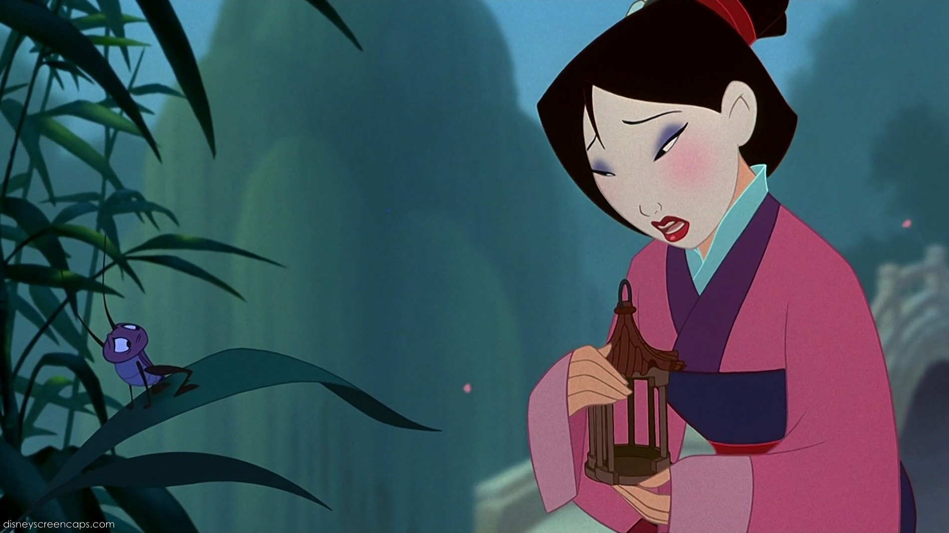 Mulan sadly looks at her cricket friend Cri-kee in its cage, a still from the Disney movie Mulan