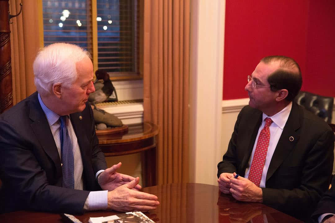 John Cornyn Sitting At A Table Wallpaper