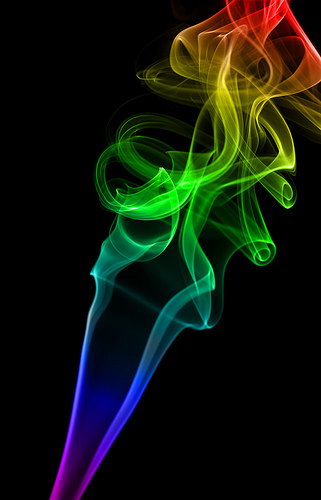Abstract Rainbow Color Smoke On Black Background Photo