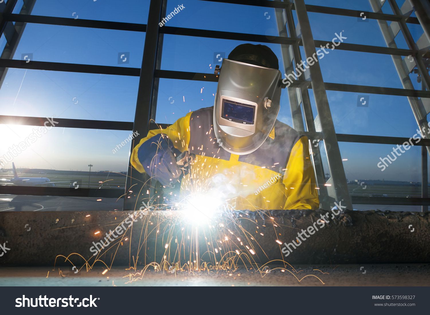 Worker Welding Metal Piping Construction Welder Background Stock