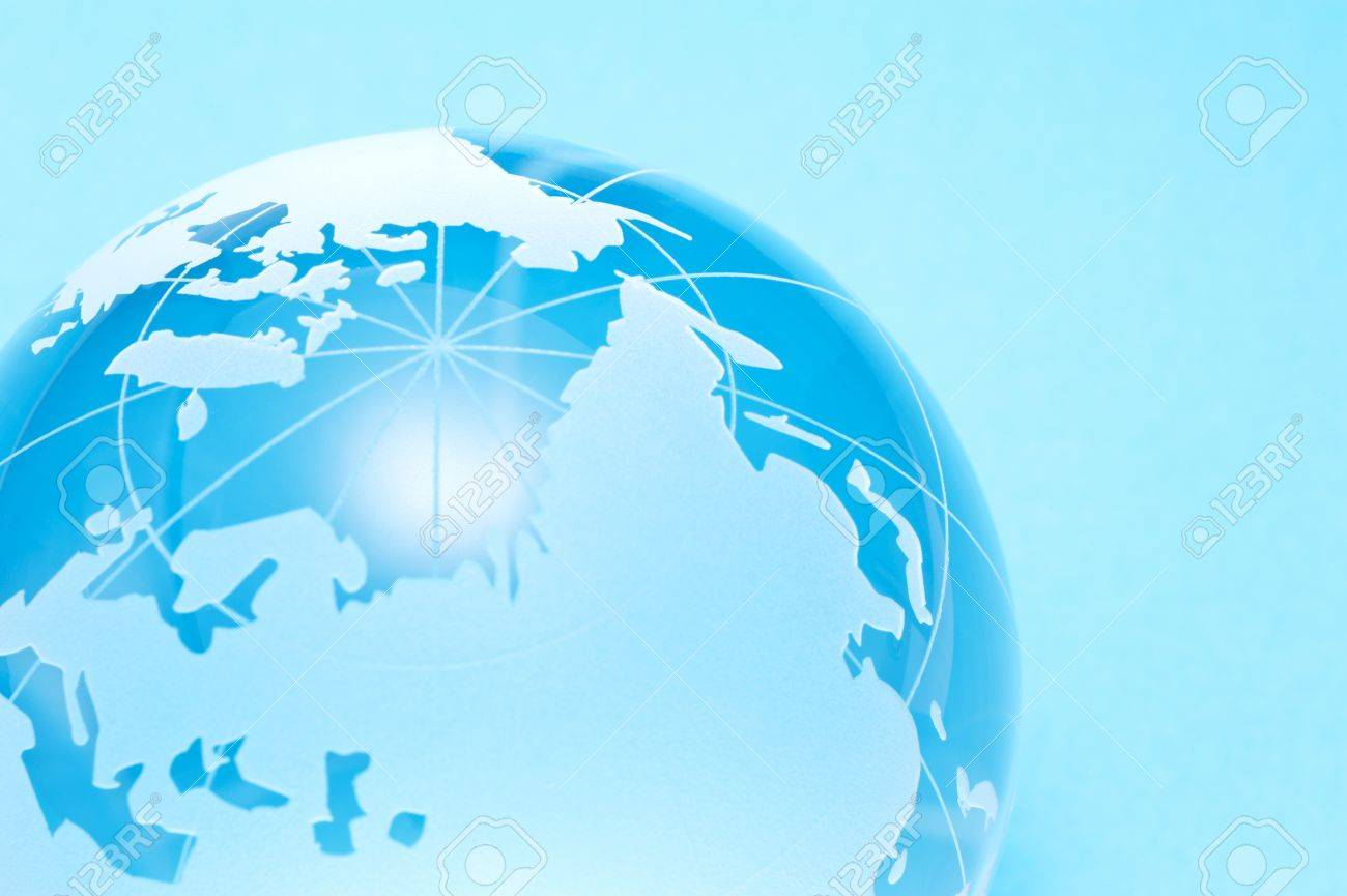 Close Up Of Glass Globe On Light Blue Background Stock Photo