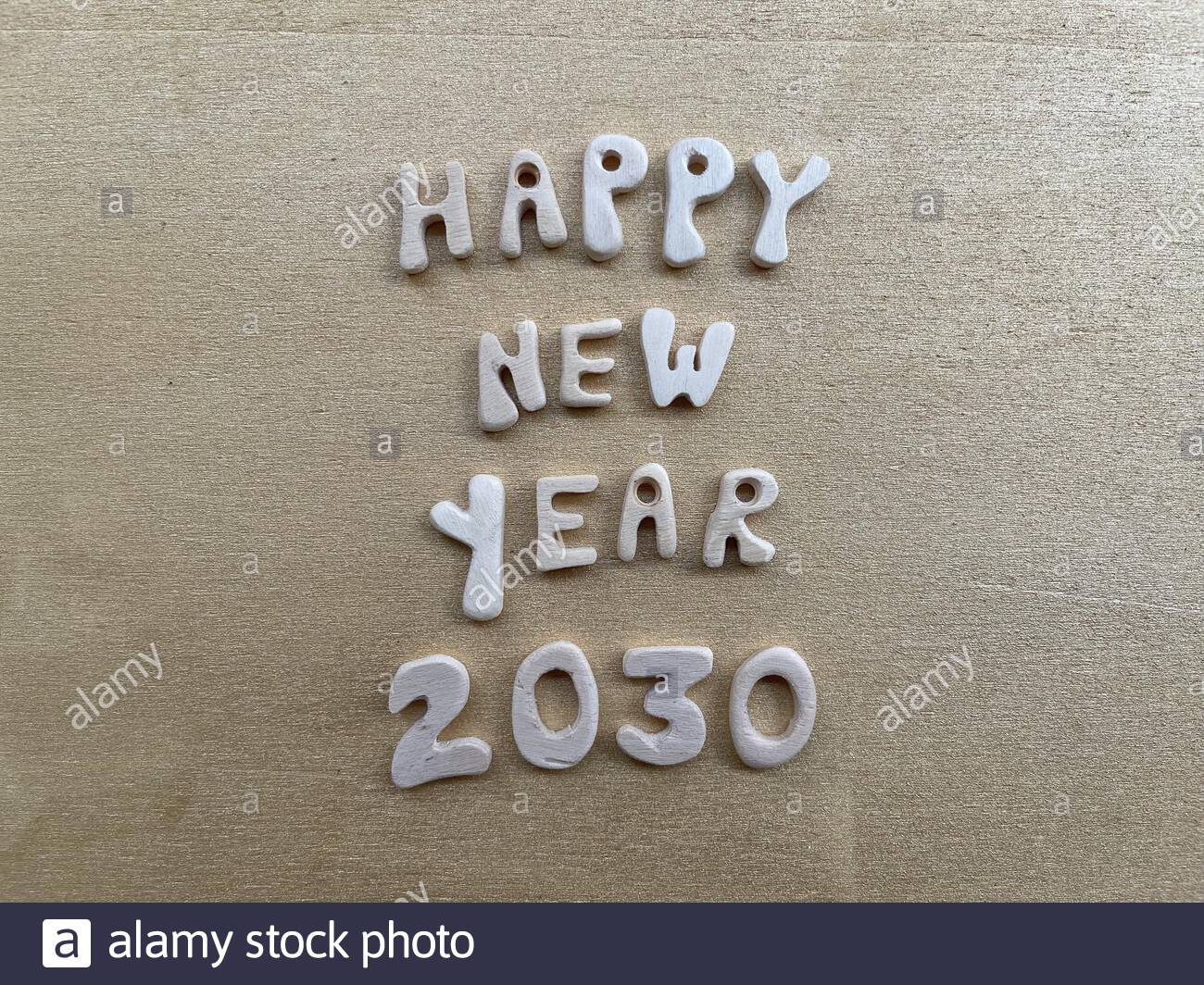 Happy New Year with wooden letters and numbers Stock Photo